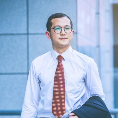 business-men-carry-laptops-work-entrance-office-building